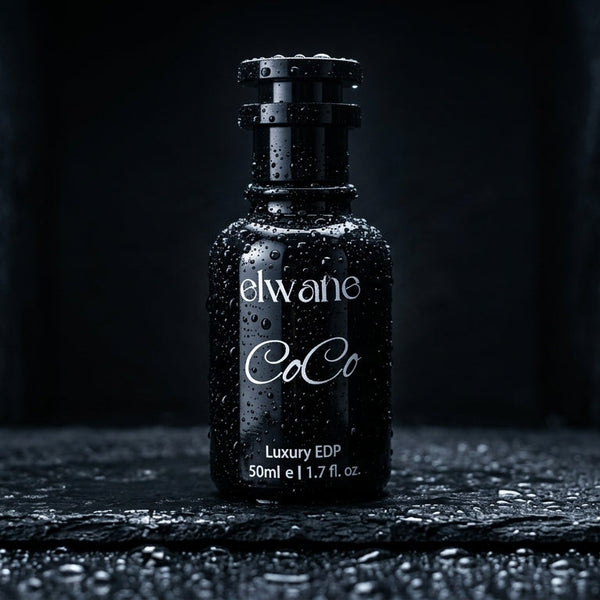 Black perfume bottle labeled 'elwane CoCo' on a dark textured surface