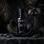Black bottle of elvane CoCo on a dark background with palm leaves and stones.