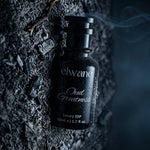 Elviant bottle on a dark, textured surface with smoke